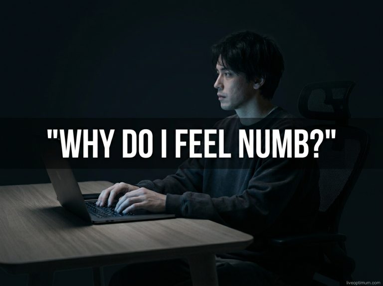 Person sitting alone at a desk at night asking why do I feel numb, staring blankly at a laptop screen