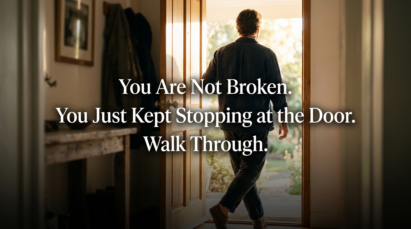 Person stepping through doorway into light representing breaking the self sabotage cycle.